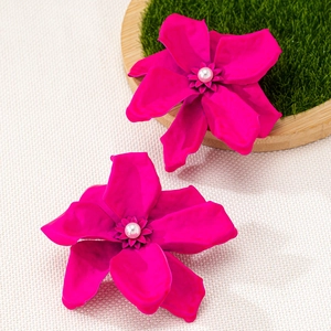 Oversized rose red floral earrings with matte petals and centered white faux pearl