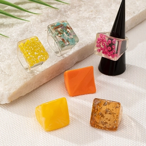 Set of six irregular geometric resin rings with colorful bead and gold foil inserts