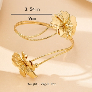 Detail view of golden floral arm cuff featuring 9cm diameter and 29g weight measurements