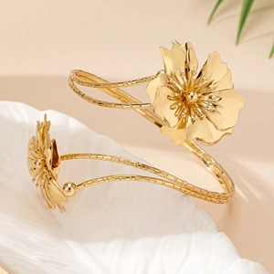 Elegant gold flower open arm cuff bracelet with twisted rope design and petal texture