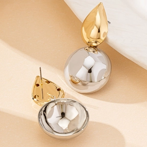 Modern gold teardrop and polished silver sphere drop earrings with minimalist metallic design