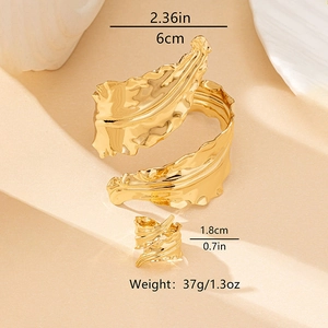 Detailed view of gold leaf-textured bracelet and ring set with dimensions and weight