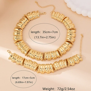 Vintage Goldschmuck-Set mit markanter Halskette und offenem Manschettenarmband