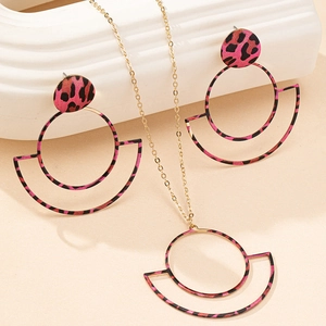 Detail of rose red leopard print earrings and necklace with gold hollow geometric circles