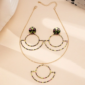 Detailed close-up of leopard print hollow circle pendant necklace and earrings set