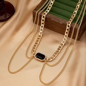 Retro multilayer gold chain necklace with large black gemstone and rhinestone accents
