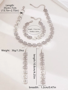 Detailed size specifications for silver geometric spiral greek key jewelry set including dimensions
