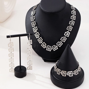 Silver geometric Greek key jewelry set including necklace, earrings and bracelet