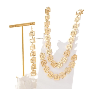 Golden Greek Key jewelry set featuring a double necklace and long dangle earrings