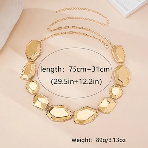 Detailed macro view of irregular geometric gold metal waist chain with lobster clasp closure