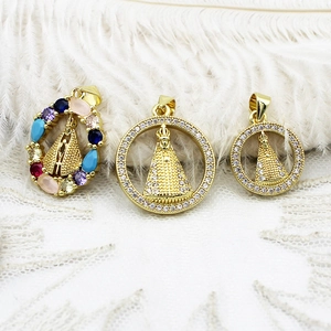 Detailed close-up of 18k gold plated Virgin Mary religious pendants with colorful zircons