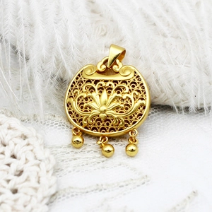 Detailed view of an ornate gold-plated filigree lotus Ruyi lock pendant with three beads