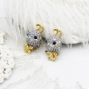 Exquisite bird pendant with micro-pave cubic zirconia and dual-tone plating on lace decor