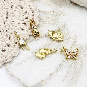 5-piece 18K gold plated DIY charms set featuring butterfly, rocket, and zircon accents