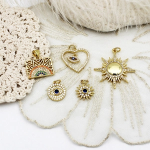 Golden sun and evil eye charms set with colorful cubic zirconia for jewelry making