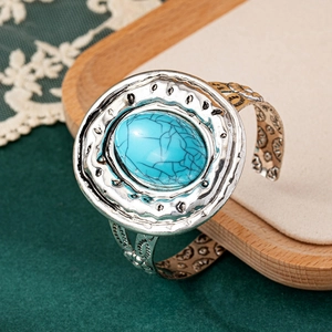 Vintage zilveren open armband met turquoise inleg en verfijnde bloemengravures in boho