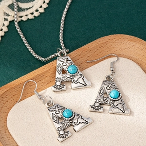 Retro letter A necklace and earrings set with turquoise inlay on a wooden tray