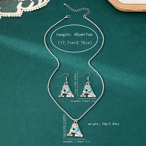 Macro shot of retro silver letter A pendant jewelry set with blue turquoise inlay