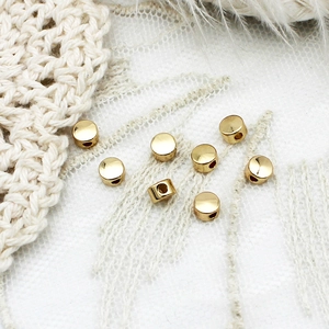 Macro shot of 18K gold plated cylindrical spacer beads for DIY jewelry making