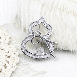Luxury silver gourd brooch with micro-pave cubic zirconia and a bowknot on lace