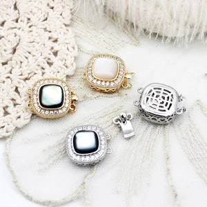 Detail of square zircon pavé jewelry clasps with shell inlay for luxury necklaces