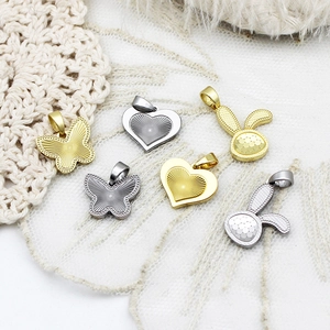 DIY metal jewelry pendants in butterfly, heart, and rabbit shapes with gold and silver finishes