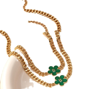 Golden Cuban chain necklace set with green enamel floral charms and letter B pendant