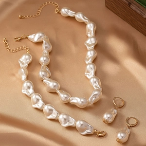 Baroque irregular pearl jewelry set with necklace bracelet and earrings on gold silk