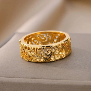 Classic gold plated ring featuring intricate filigree engraving in a vintage boho style