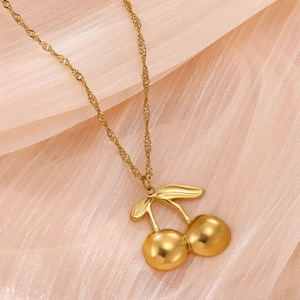 Detailed close-up of 18k gold plated cherry pendant on a twisted rope chain necklace
