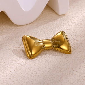 Elegant gold bow brooch with mirror polished finish for vintage style jackets