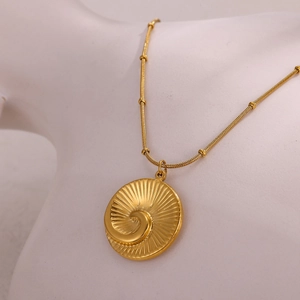 Gold stainless steel necklace with sunburst embossed turtle shell pendant on bead chain