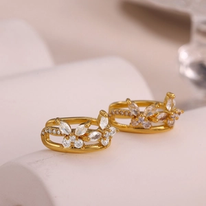 Exquisite gold-plated butterfly hoop earrings with sparkling cubic zirconia on white stand