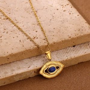 Bohemian gold stainless steel necklace featuring a mystical blue eye pendant on stone