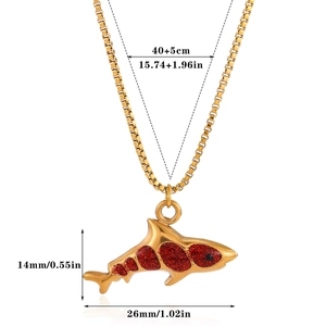 Detailed size specifications for a gold shark pendant necklace with red glitter accents