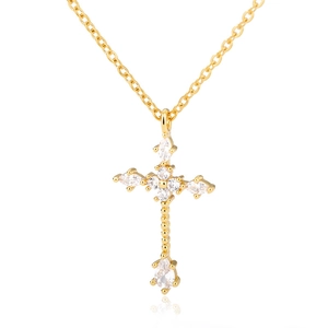 Elegant gold-tone copper cross necklace featuring sparkling marquise and round cubic zirconia stones