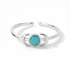 Silver adjustable ring featuring a round blue moonstone center and crescent moon accents