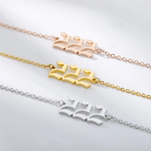 Detailed close-up of 222 angel number pendants in gold, silver, and rose gold finishes