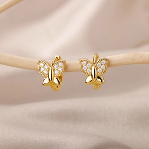 Detailed close-up of 18k gold plated butterfly hoop earring with white cubic zirconia stones