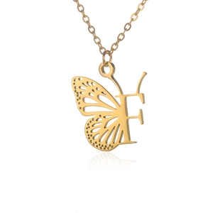 Golden butterfly wing pendant necklace with letter F in a polished metallic finish