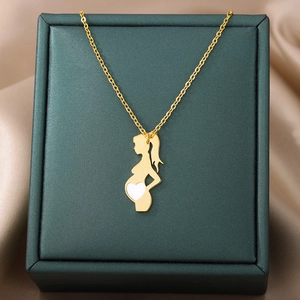 Close-up of golden silhouette necklace for moms on velvet green jewelry gift box