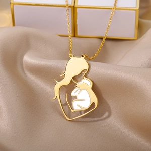 Close-up of golden mother and child pendant on champagne silk for Mother's Day gift