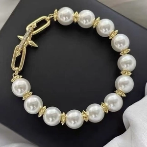 Elegant 18K gold plated pearl bracelet with CZ cross star T-bar clasp and gear spacers