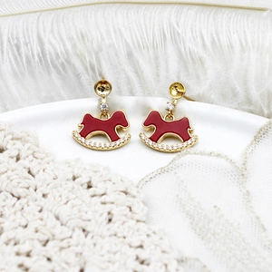 Elegant red rocking horse stud earrings with gold plating and white zircon accents