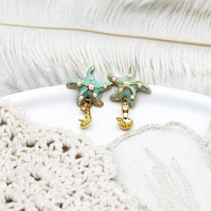 Detail of starfish earring settings with blue enamel pearls and DIY semi-finished components