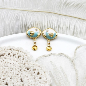 Ocean series starfish and shell earrings with blue enamel, pearls, and empty stone mount