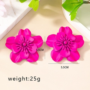 Detailed close-up of 5.5cm matte magenta flower earrings with layered petals design