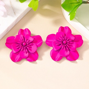 Detail view of large rose pink layered flower earrings with matte finish and center pistils