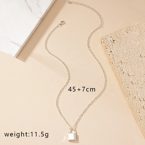 Detail view of silver lock pendant necklace showing chain dimensions 45cm and 11.5g weight