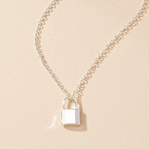Minimalist silver padlock pendant necklace with polished mirror finish on dainty chain